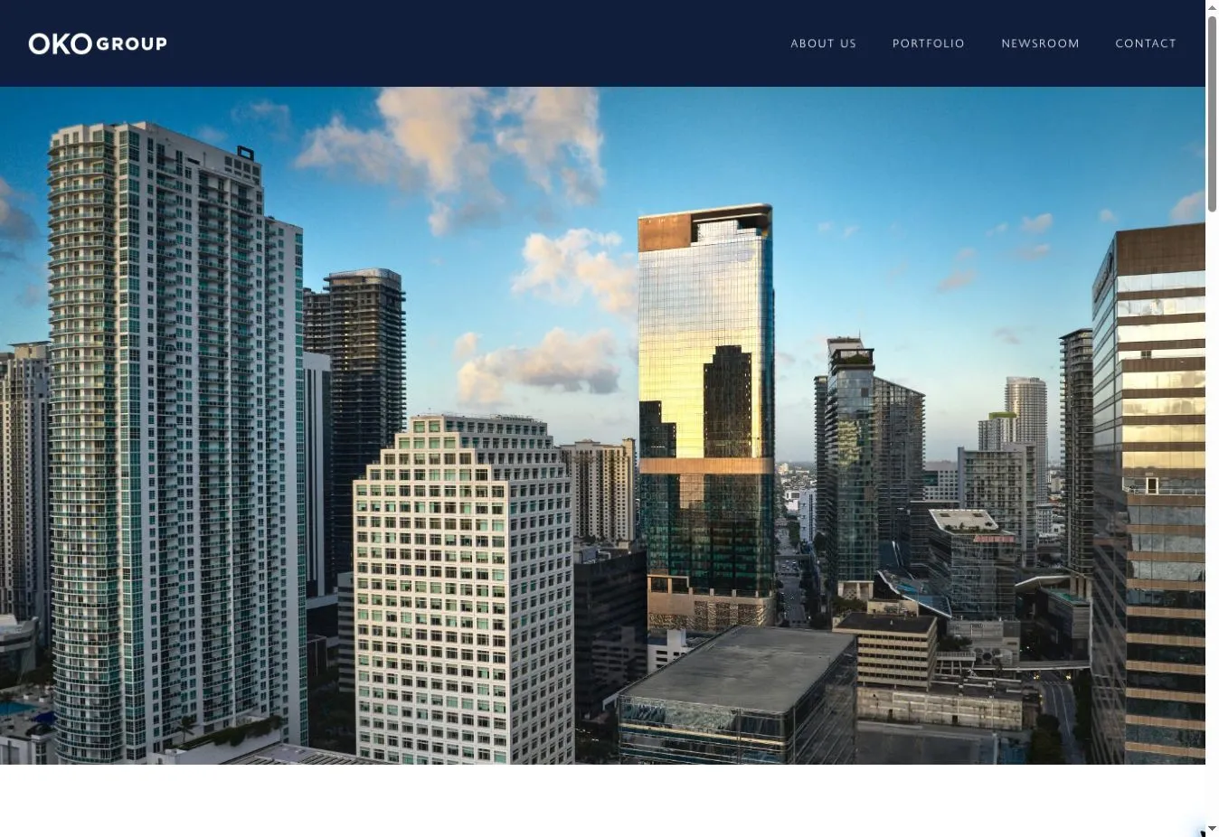 OKO Group homepage with a Miami skyline photograph featuring 830 Brickell beneath the main navigation