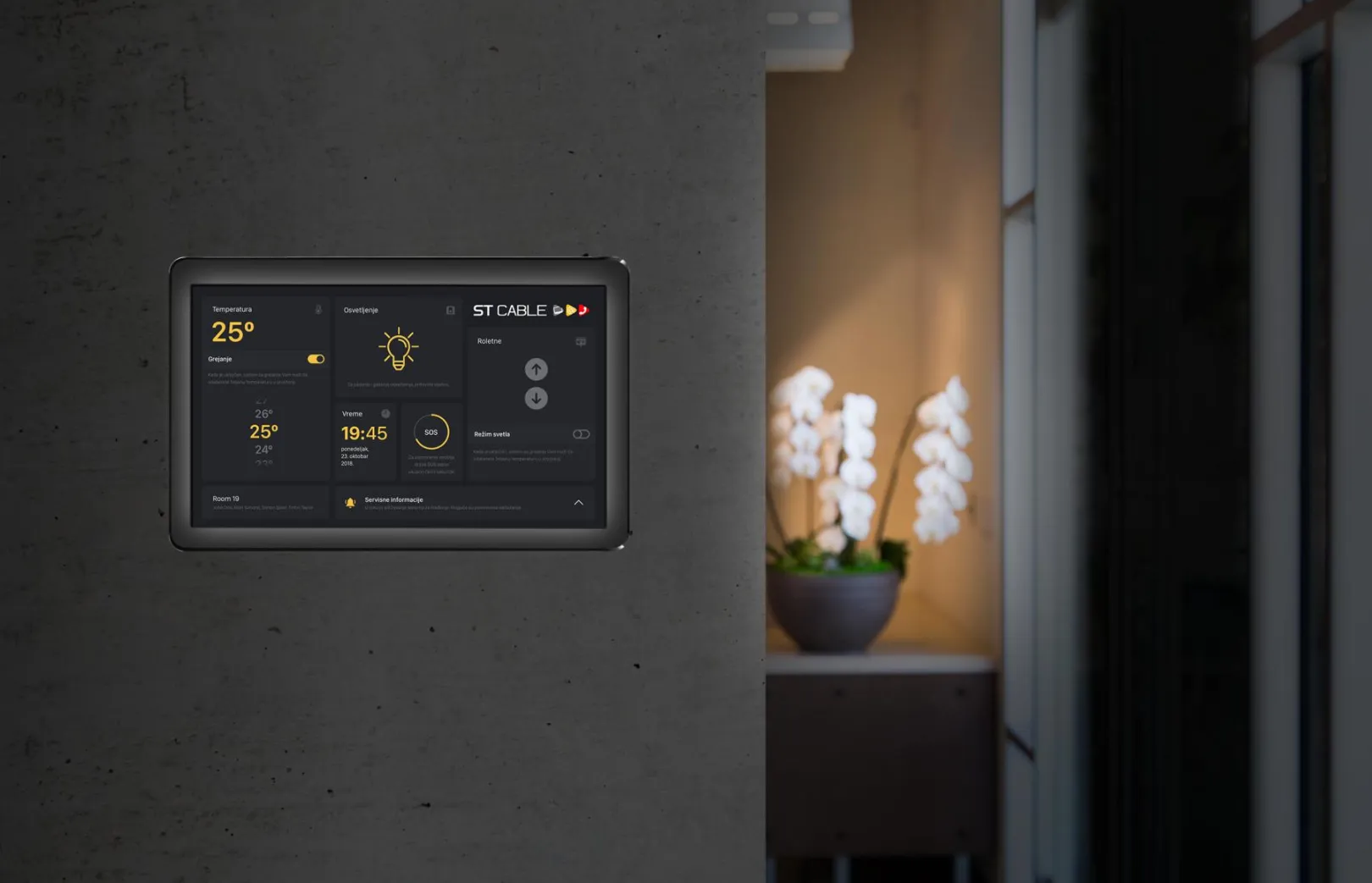 Academy - IoT for smart hotels and buildings, tablet in the dark mode, mounted on the wall
