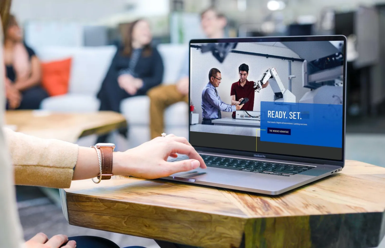 The Widener University homepage displayed on a laptop