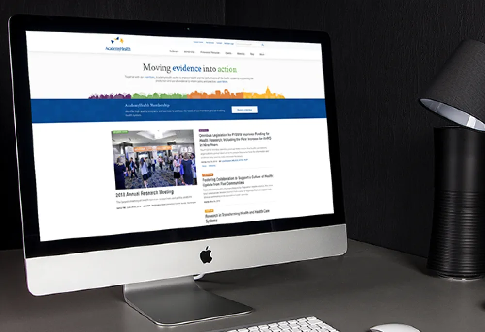 AcademyHealth home page displayed on an iMac