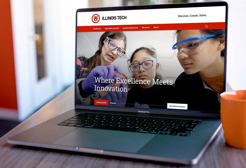 The Illinois Tech homepage displayed on a laptop