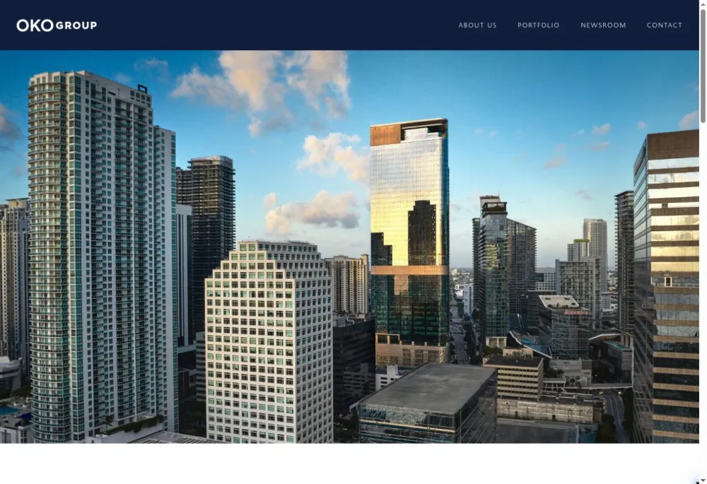 OKO Group homepage with a Miami skyline photograph featuring 830 Brickell beneath the main navigation