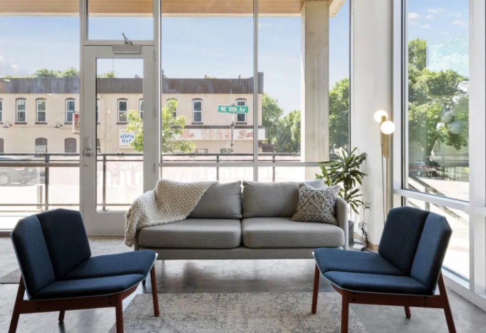 Interior apartment view looking out the window. Outside the windows you see the 1029 Bar in NE Minneapolis.