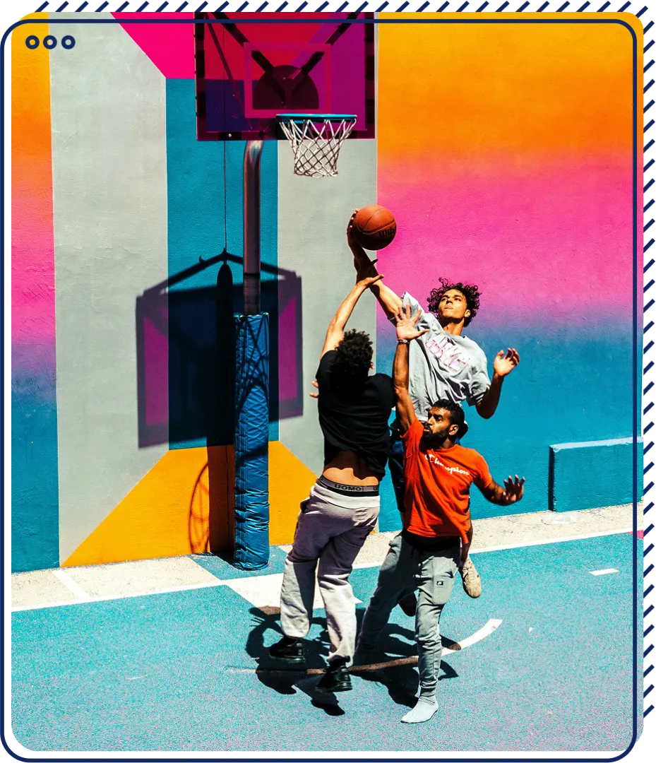 3 men playing basketball