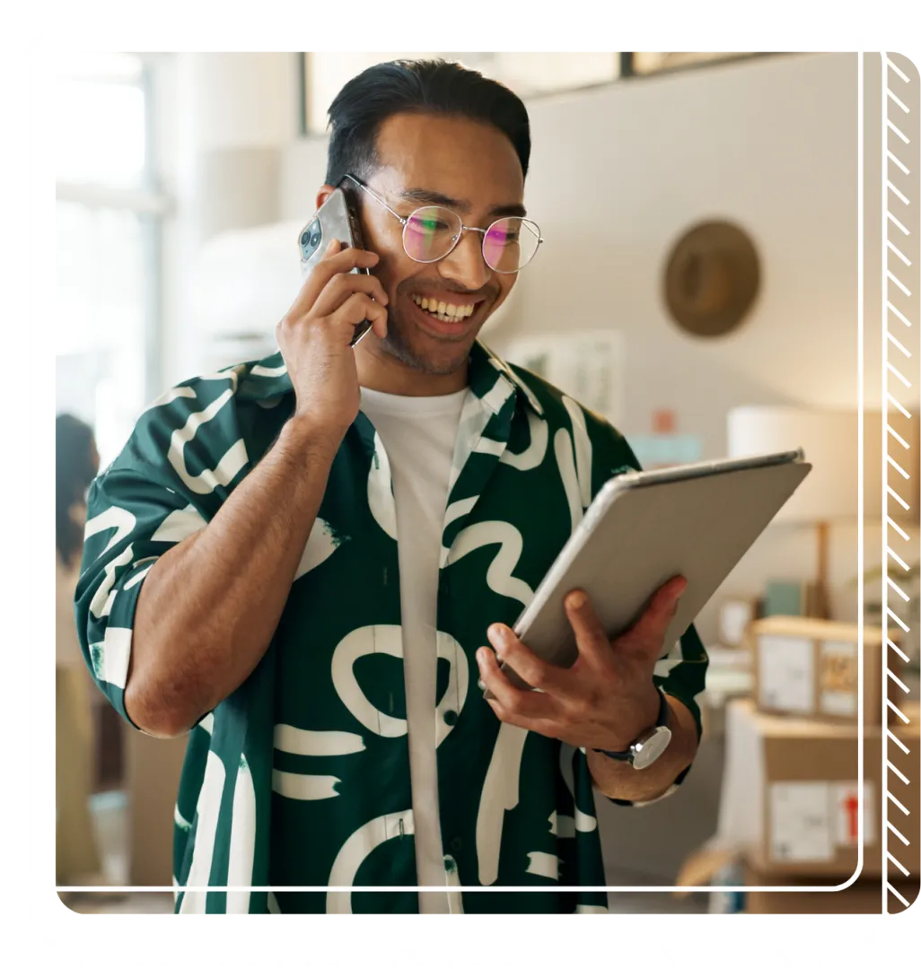 Retail working in green shirt talks on the phone