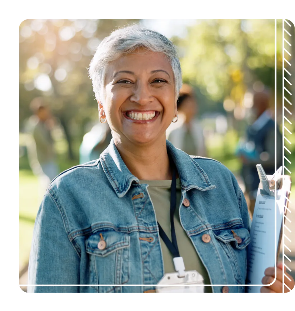 Woman with clipboard smiling 