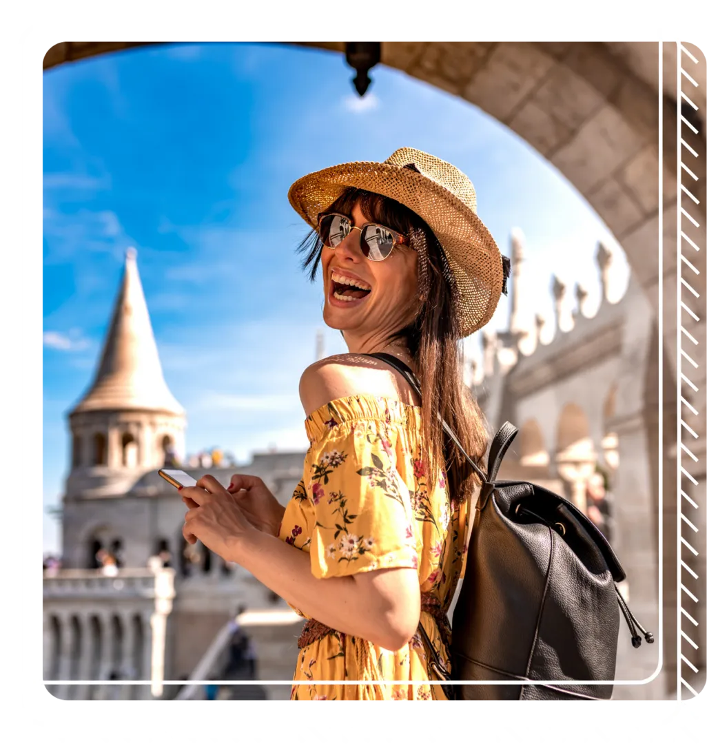 Young woman in a hat and yellow dress on vacation