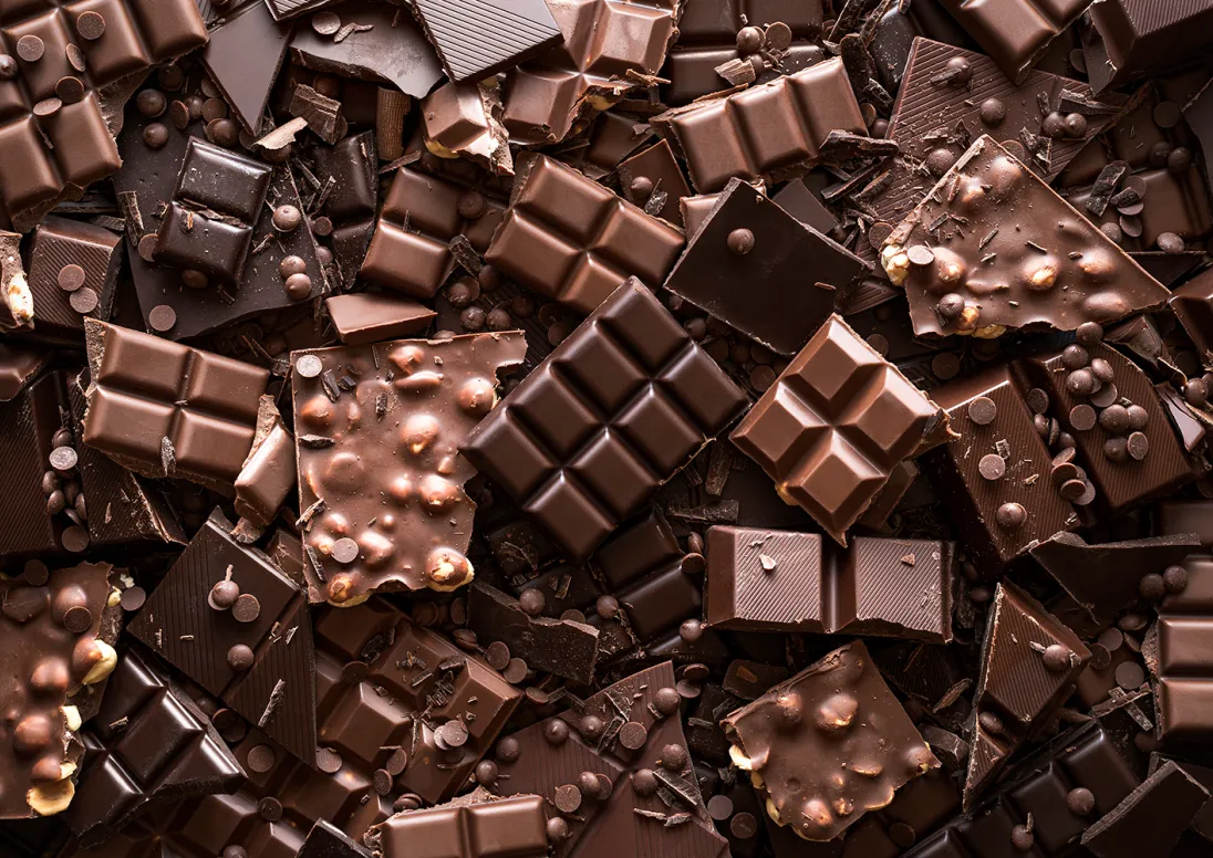 A mix of Chocolate bars in a pile
