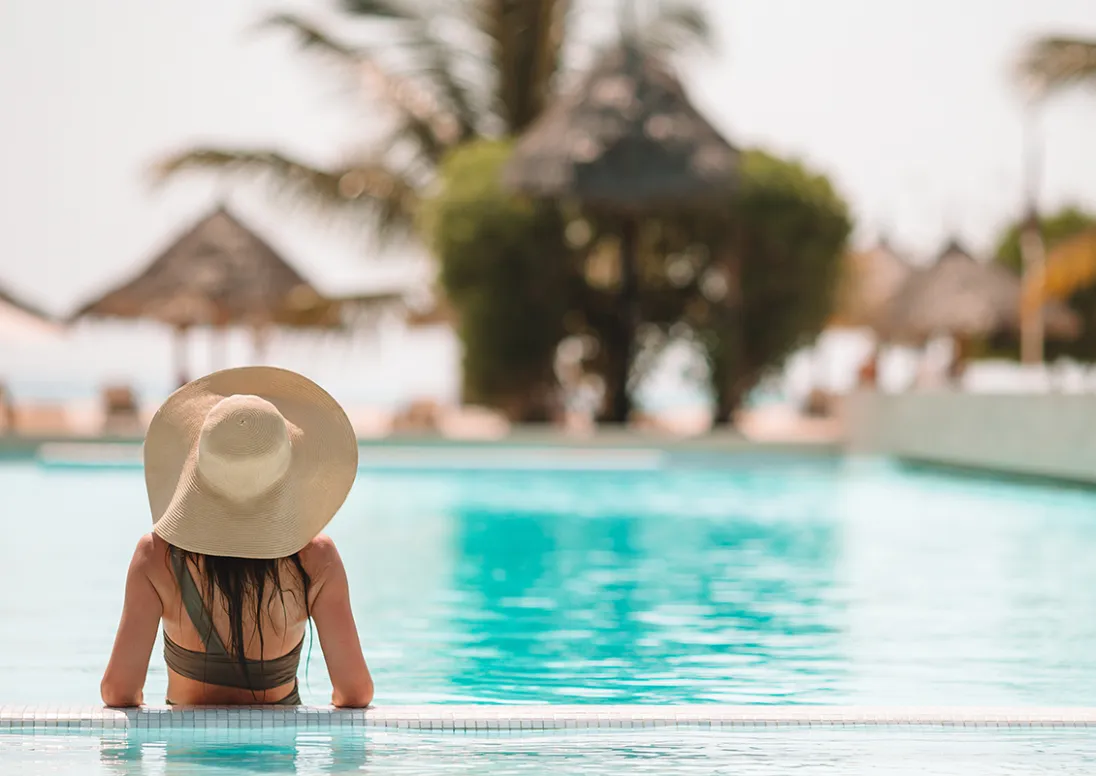 Woman in a pool at a resort