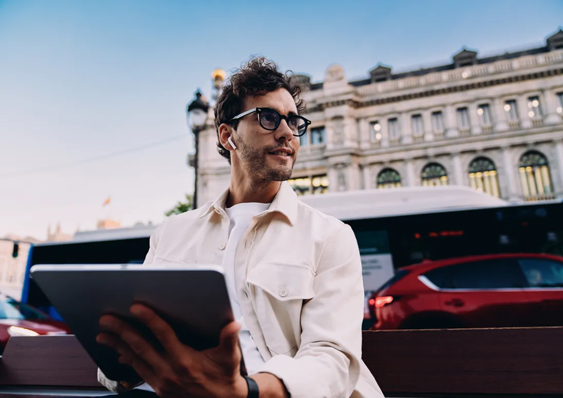 Young man works on a tablet 