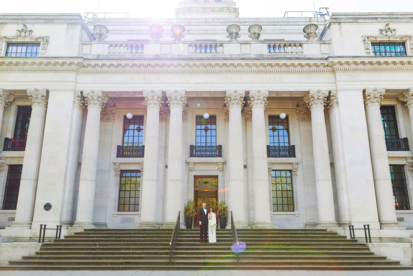 The columned frontage of Old Marylebone Town Hall, with a couple standing on the steps
