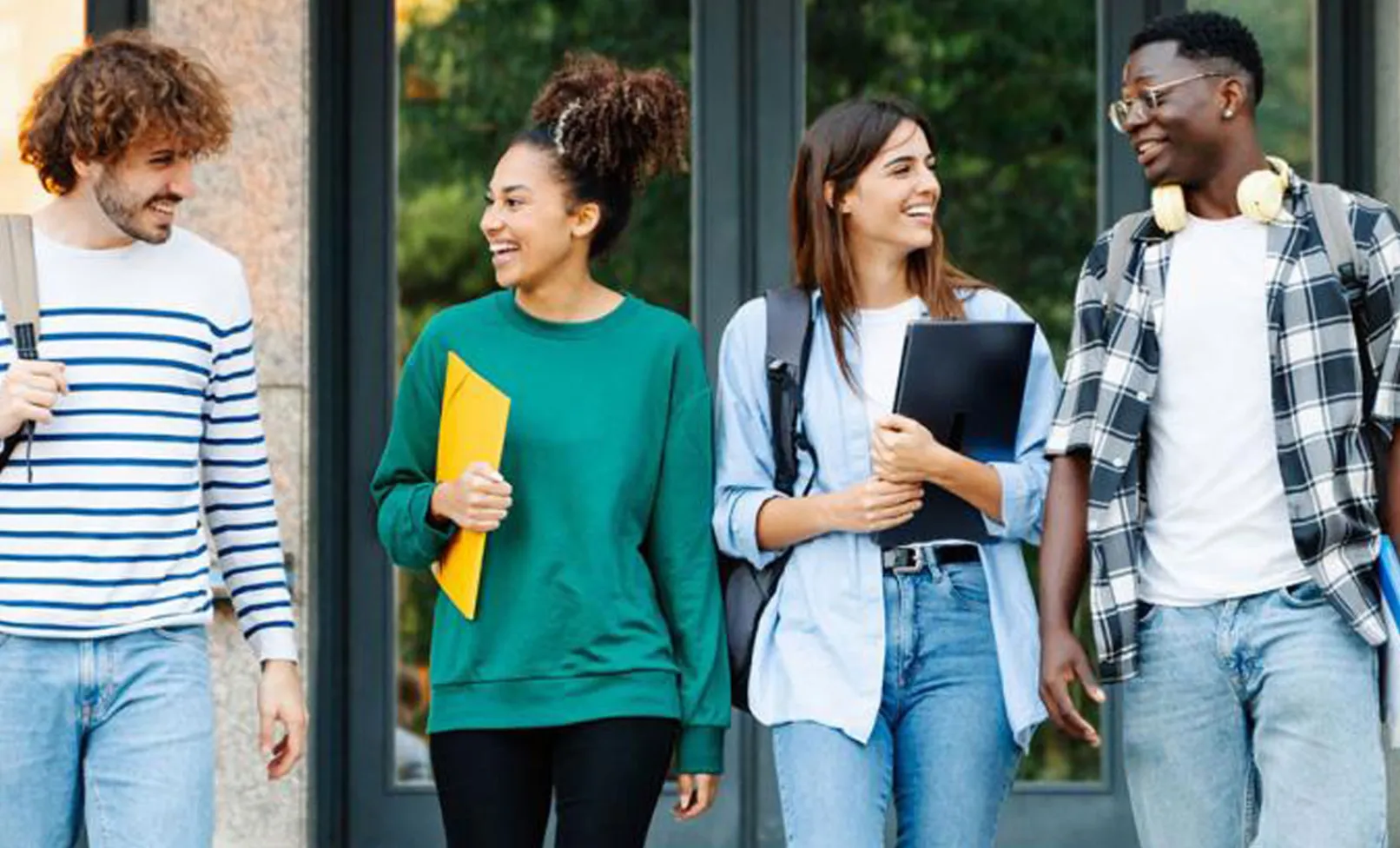 college age students walking together outdoors