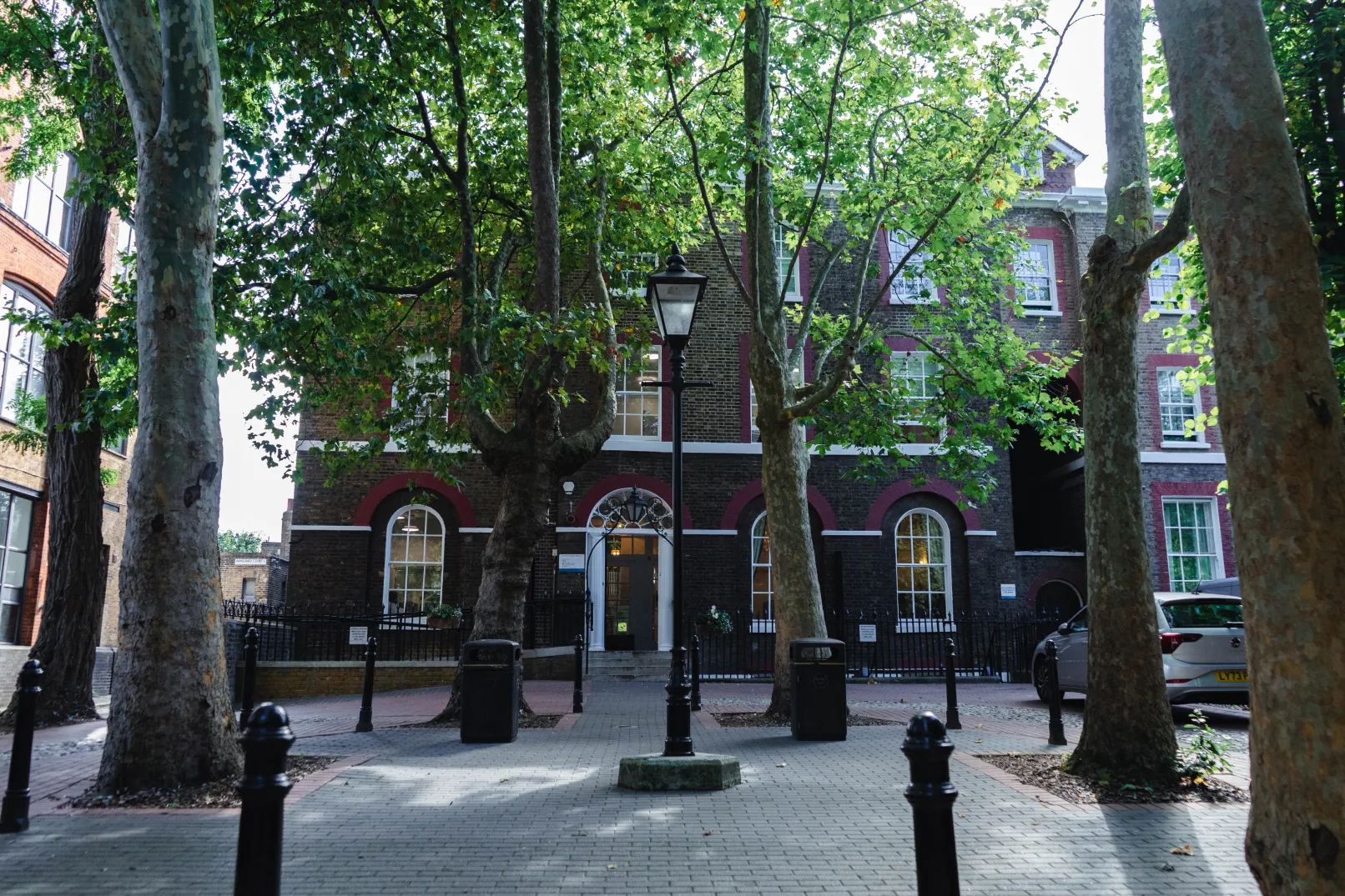 Camberwell House register office behind mature trees on Peckham Road, Southwark